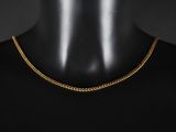 un collier à chaîne en or sur un mannequin mannequin mannequin mannequin mannequin mannequin mannequin mannequin mannequin mannequin