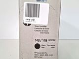 a close up of a box of black ink on a white surface