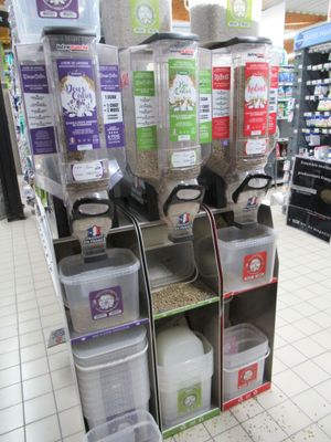 many containers of food on the shelves in the store