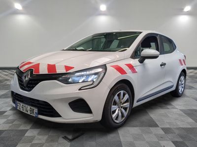 a white car with red and white stripes parked in a garage