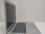 a laptop computer sitting on a table with a white background