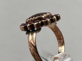 a close up of a ring with a stone on top of it