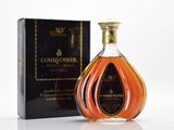 the bottle of courvoisir is next to a box of wine
