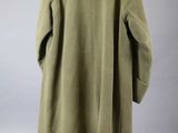 the back of a green coat hanging on a hanger
