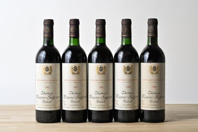 six bottles of wine are lined up on a wooden table