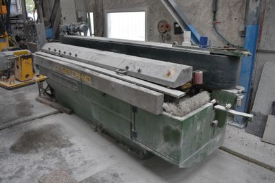 a machine that is working on a piece of metal