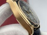 a watch that is being held by someone in a glove