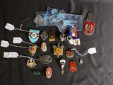 a lot of pins and other items on a table