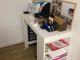 a white desk with a computer on top of it