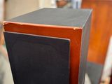 two speakers sitting on top of each other in a room