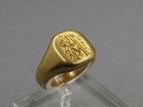 an image of a gold signet ring with an elephant on it