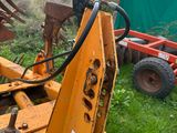 an image of a tractor that is sitting in the grass