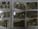 a picture of a bunch of old postcards on a table