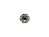 an image of a black and white diamond ring on a white background