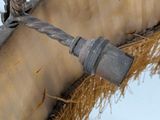 a close up of a rope hanging from a lamp