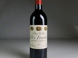 a bottle of wine that is sitting on a table