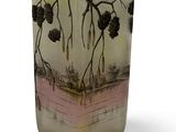 a glass vase with a picture of a tree on it