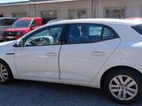 a picture of a white car parked in a parking lot