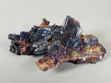 a close up of a piece of rock with a rock in the background