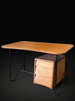 an image of a wooden desk with a drawer underneath it