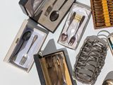 many different types of silverware on the table