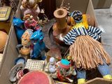 a cardboard box filled with assorted items on the floor