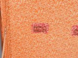 an open suitcase that has a flower pattern on it