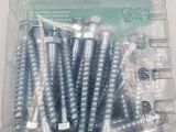 many screws in a plastic container on a table