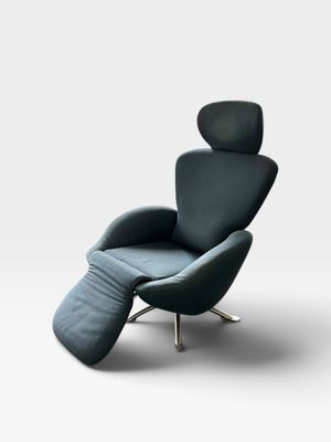 a black leather recliner chair with a footstop and foot rest