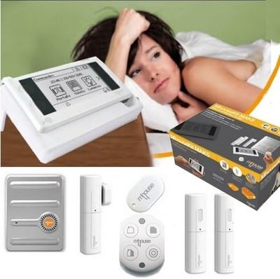a picture of a woman laying in bed with a remote control