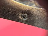 a close up view of a piece of wood with a hole in it