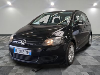 the black volkswagen b - cross is parked on a checkered floor