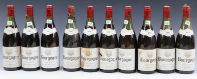 six bottles of wine lined up in a row on a table