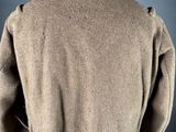 the back view of a man ' s coat on a mannequin mannequin mannequin mannequin mannequin mannequin mannequin