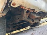 a close up of a car ' s rear end with rust on it