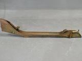 an old brass pipe cutter sitting on top of a white surface