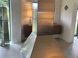 a large stainless steel stove in the middle of a room