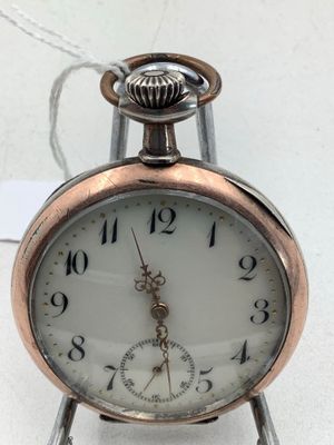 montre à gousset en argent et métal.