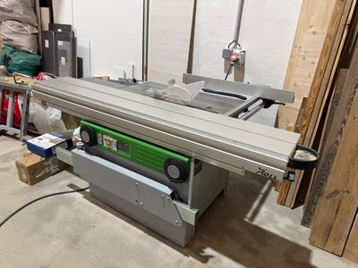 an image of a table saw in a garage