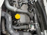 the engine of a car with its hood open and the hood down