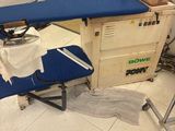 a blue ironing board sitting on top of a blue ironing board