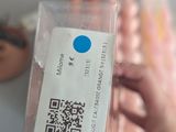 a person holding a plastic bag with a qr code on it