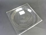 a glass plate on a table with a black background