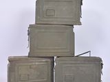 three gray boxes stacked on top of each other on a white surface