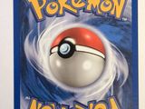 a close up of a pokemon card with a red and white ball