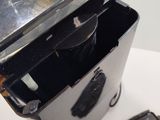 a metal container with a mirror on top of it
