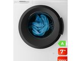 un gros plan d'une machine à laver avec un chiffon bleu à l'intérieur