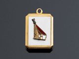 a gold plated pendant with a picture of a baseball bat and ball