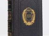 a black book with a gold emblem on the cover