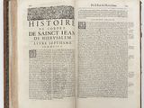 an open book on a table with a black and white image